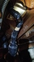 1) pipe right is under shower - trap? -left pipe is under toilet. Then goes through wall vent.jpg