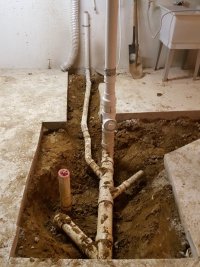 Sewer pipes under concrete.jpg